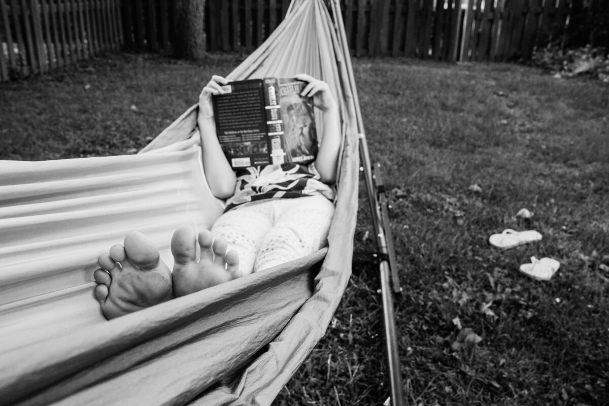 the life: a backyard hammock. a book. bare feet.